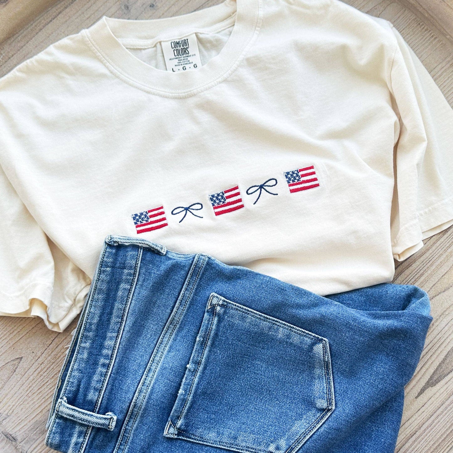 American Flag and Dainty Bow Embroidered Comfort Colors T-Shirt: 100% Cotton / Ivory
