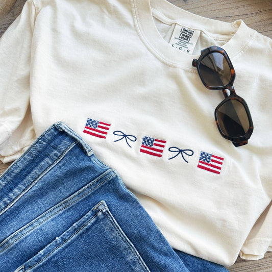 American Flag and Dainty Bow Embroidered Comfort Colors T-Shirt: 100% Cotton / Ivory